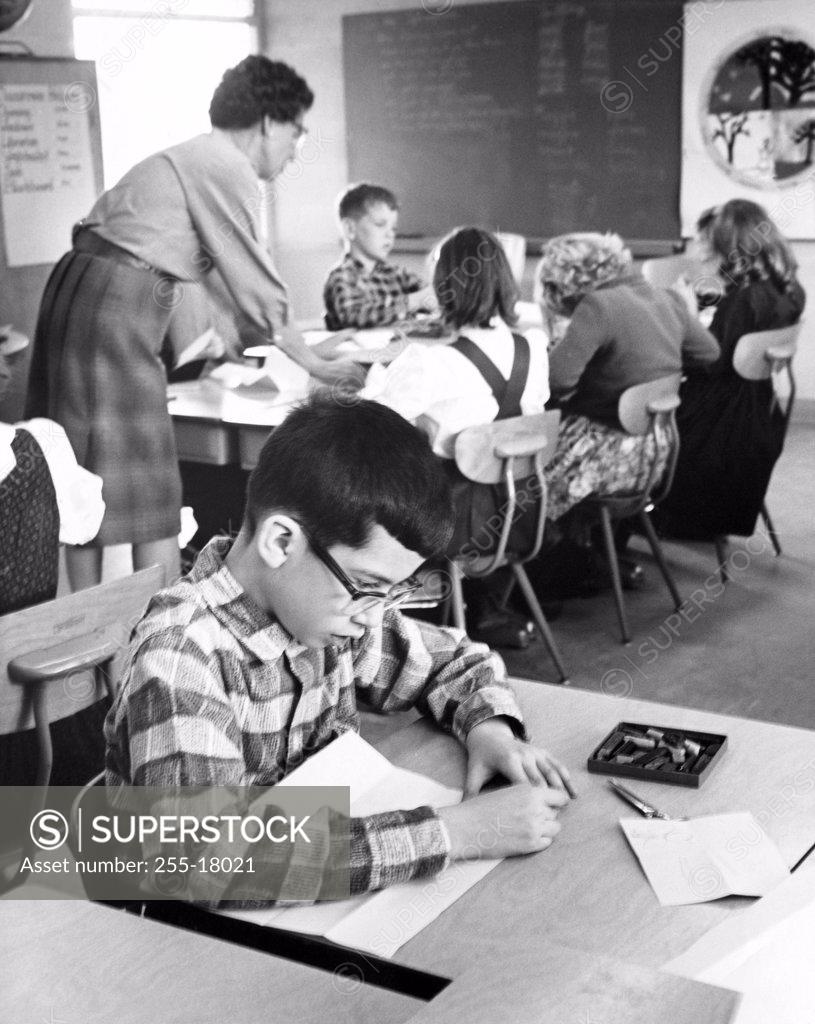 Stock Photo: 255-18021 School children in a classroom with a female teacher