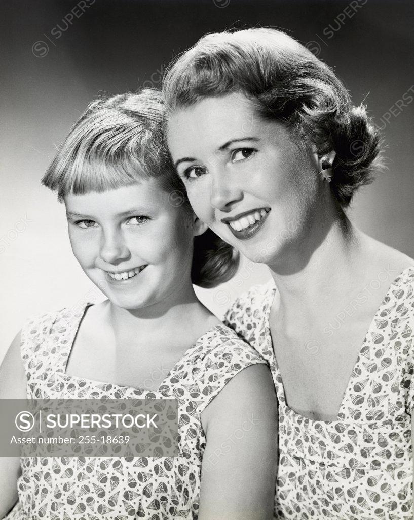 Stock Photo: 255-18639 Portrait of a mid adult woman smiling with her daughter