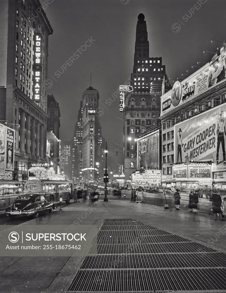 Times Square at night with Paramount and Times Square buildings. New York City.