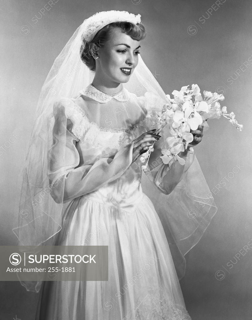 Stock Photo: 255-1881 Bride smiling and holding a bouquet