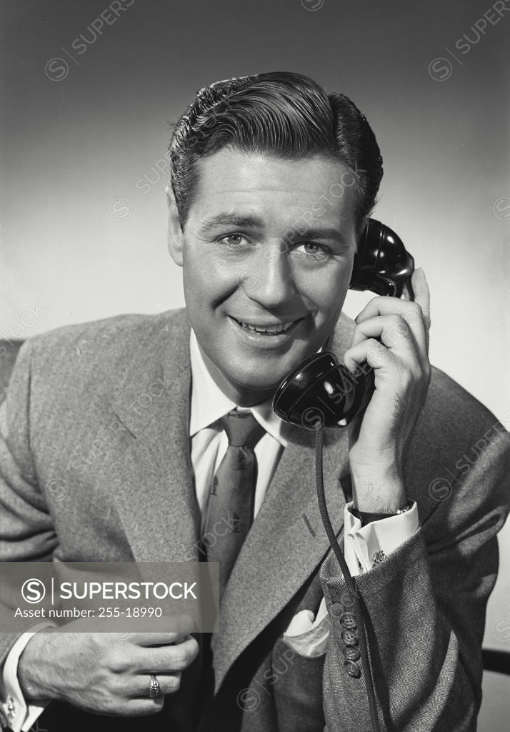 Stock Photo: 255-18990 Portrait of a businessman talking on the telephone