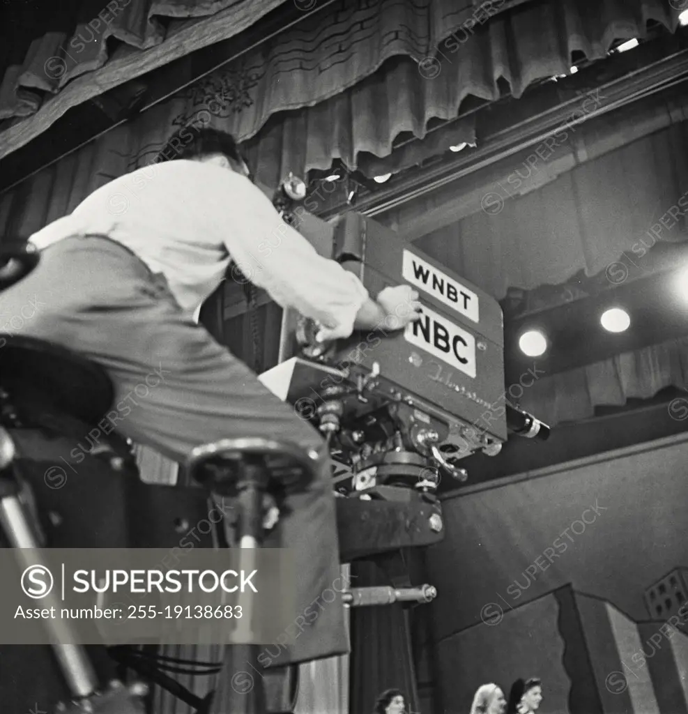 Vintage photograph. Man operating NBC TV Camera