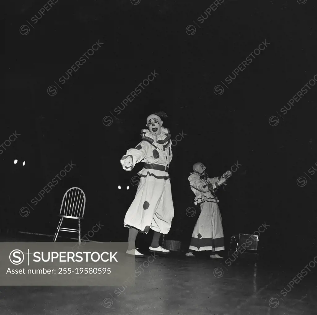 Vintage photograph. Clowns performing at circus