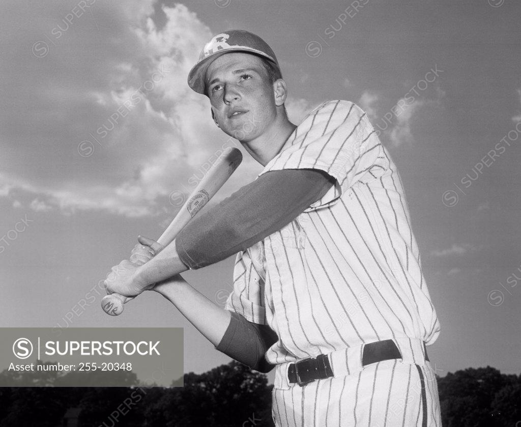 Stock Photo: 255-20348 Baseball player swinging a baseball bat