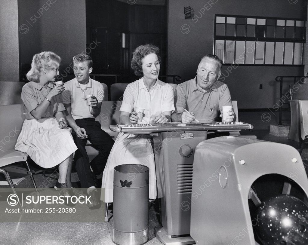 Stock Photo: 255-20380 Family at a bowling alley