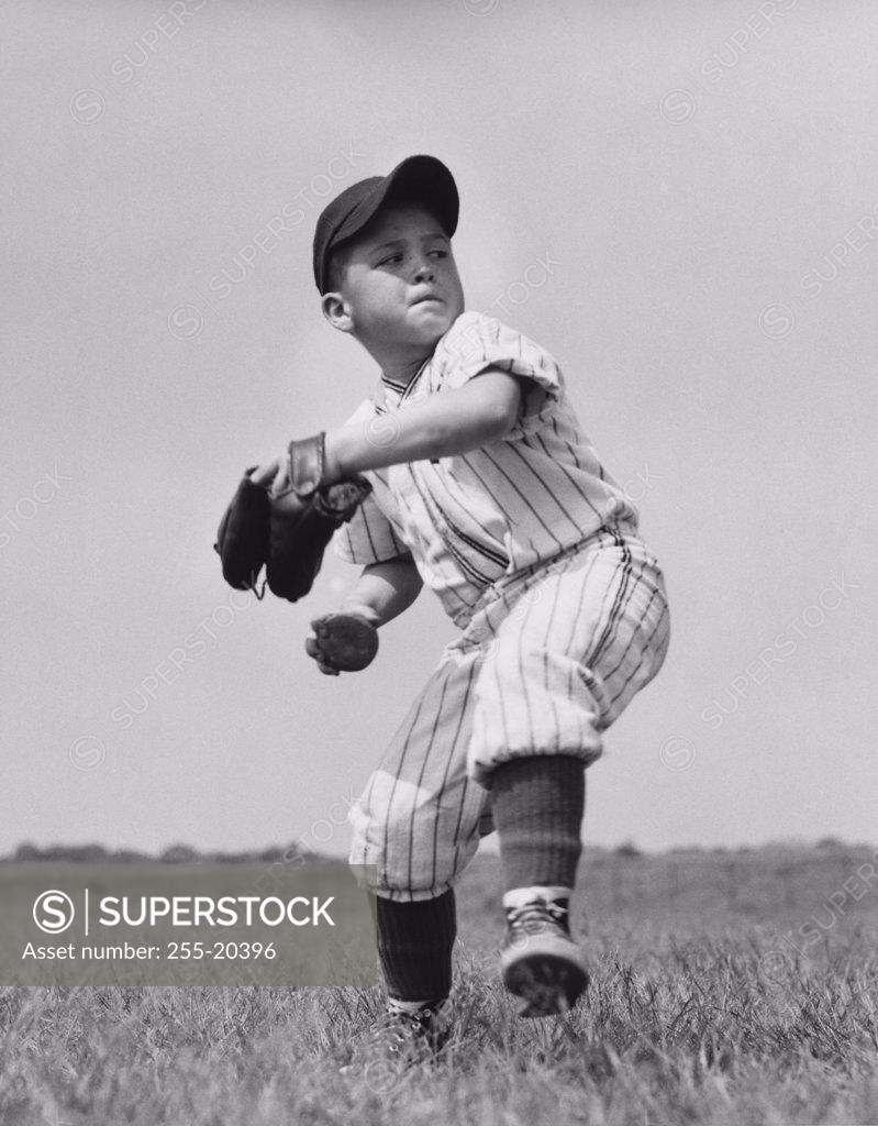 Stock Photo: 255-20396 Youth league baseball player throwing baseball
