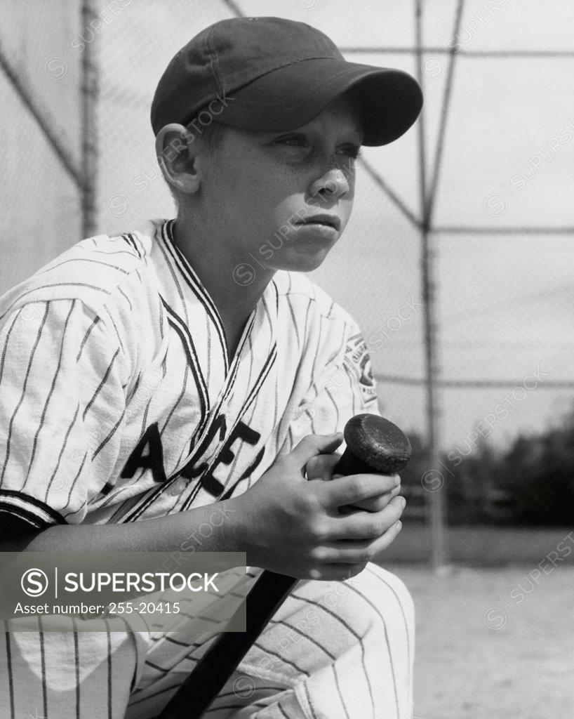 Stock Photo: 255-20415 Close-up of a boy holding a baseball bat