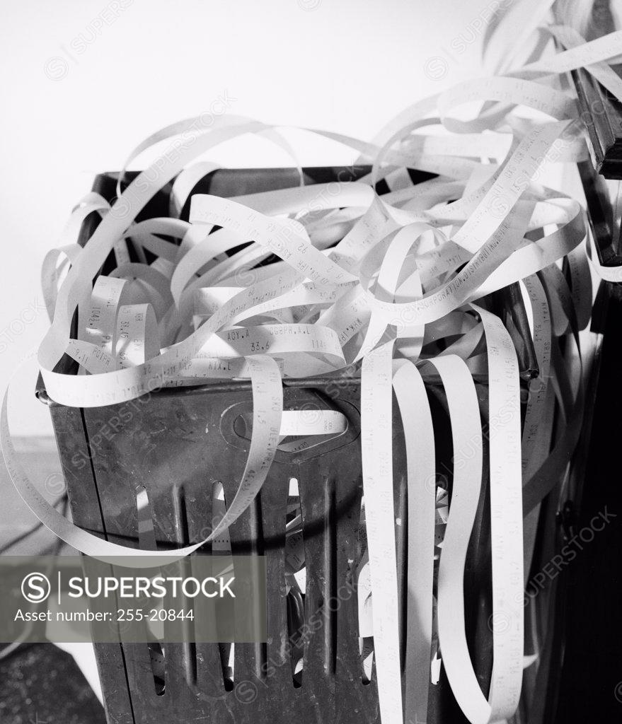 Stock Photo: 255-20844 Close-up of ticker tapes in a garbage bin