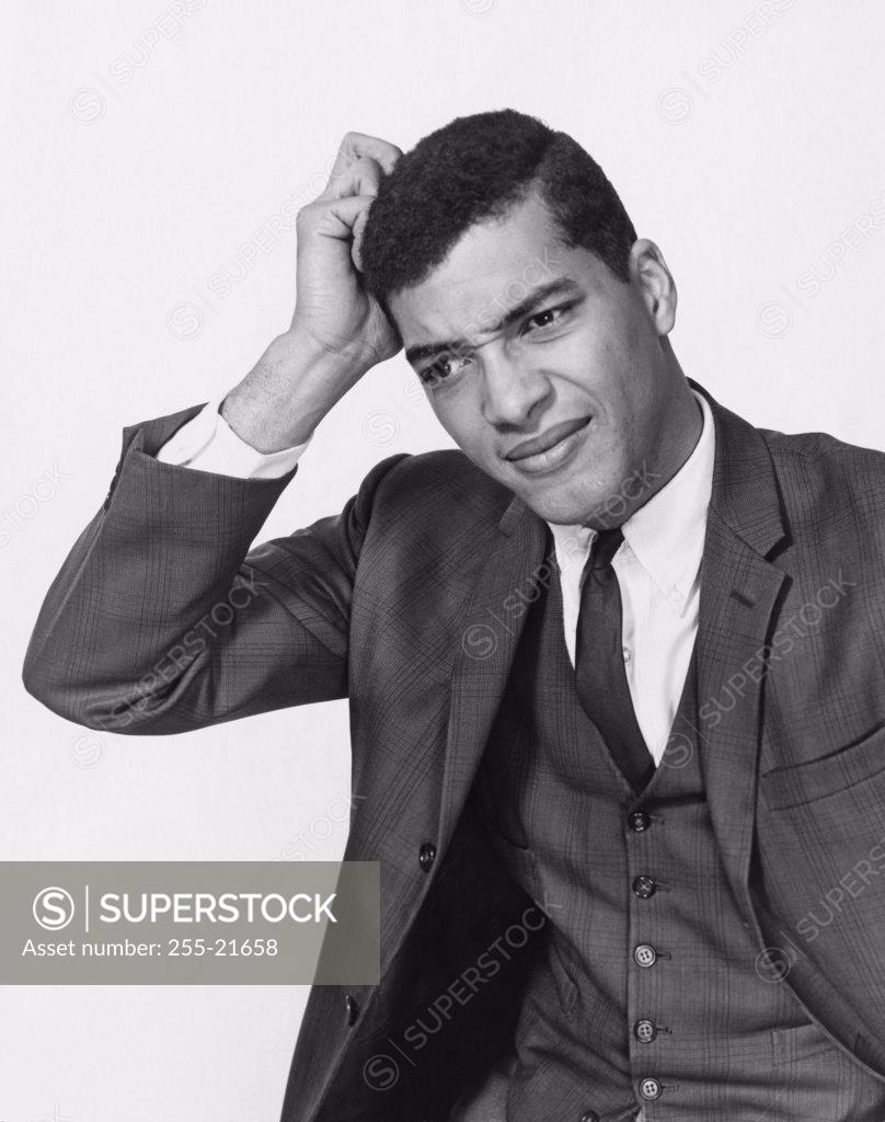 Stock Photo: 255-21658 Close-up of a businessman scratching his head