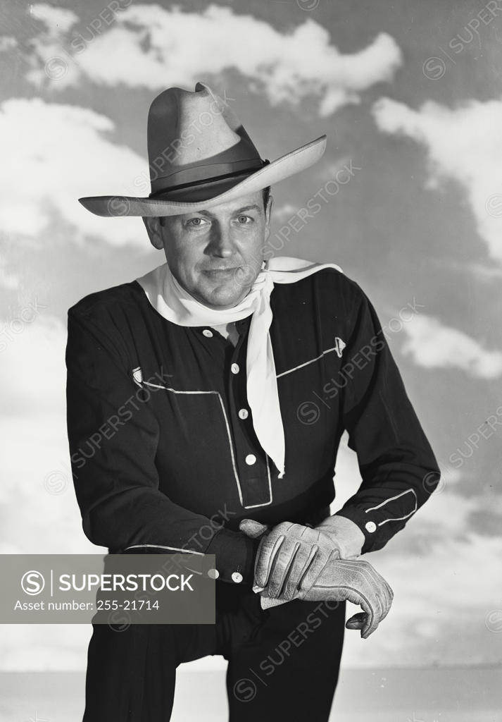 Stock Photo: 255-21714 Portrait of a cowboy smirking
