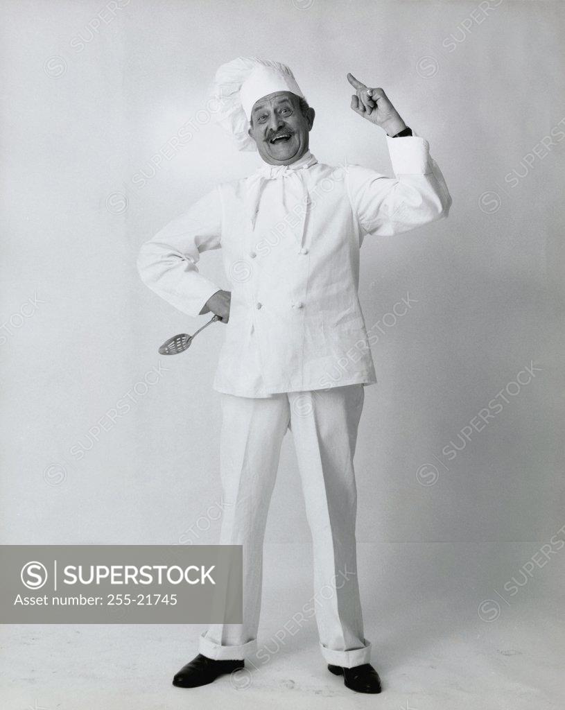 Stock Photo: 255-21745 Chef smiling with his hand on his hip