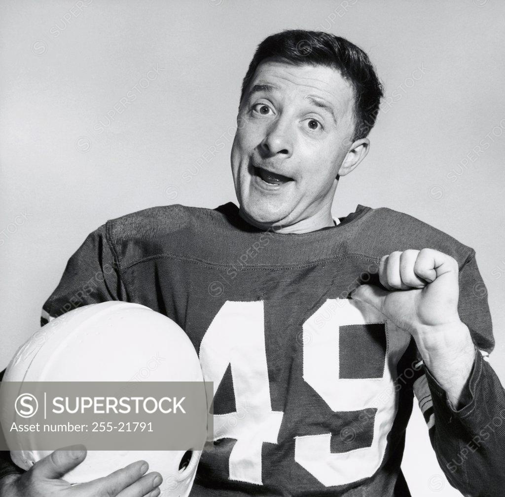 Stock Photo: 255-21791 Portrait of a football player pointing at himself