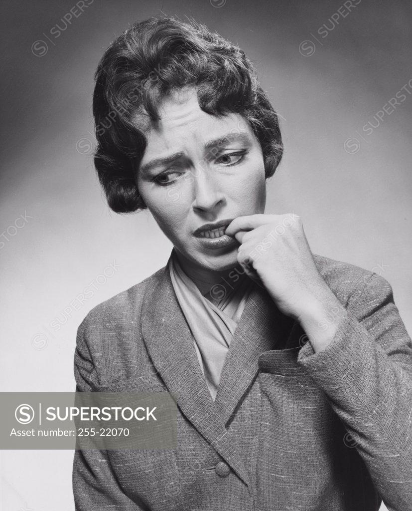 Stock Photo: 255-22070 Close-up of a young worried woman