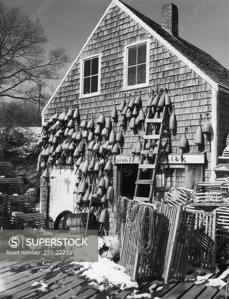 Stock Photo: 255-22222 Buoys hanging from a building, New Harbor, Bristol, Maine, USA