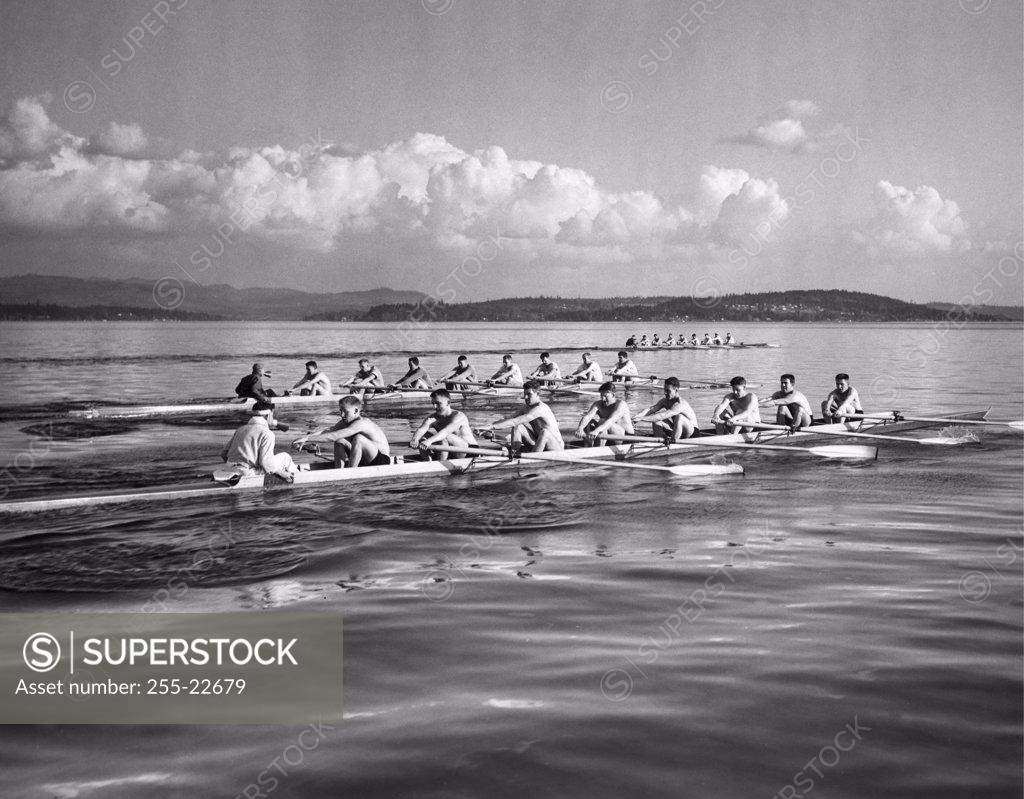 Stock Photo: 255-22679 Group of men rowing rowboats in a sweep rowing race, Lake Washington, Washington, USA