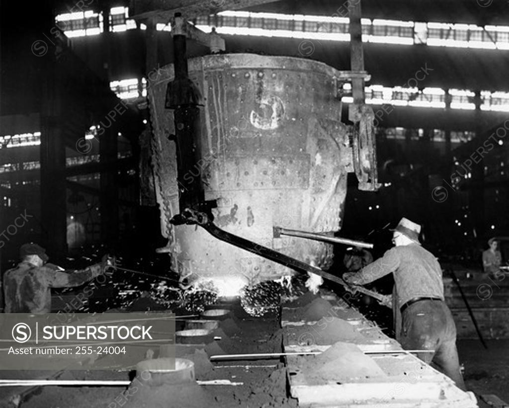 Stock Photo: 255-24004 Foundry workers working in a steel foundry