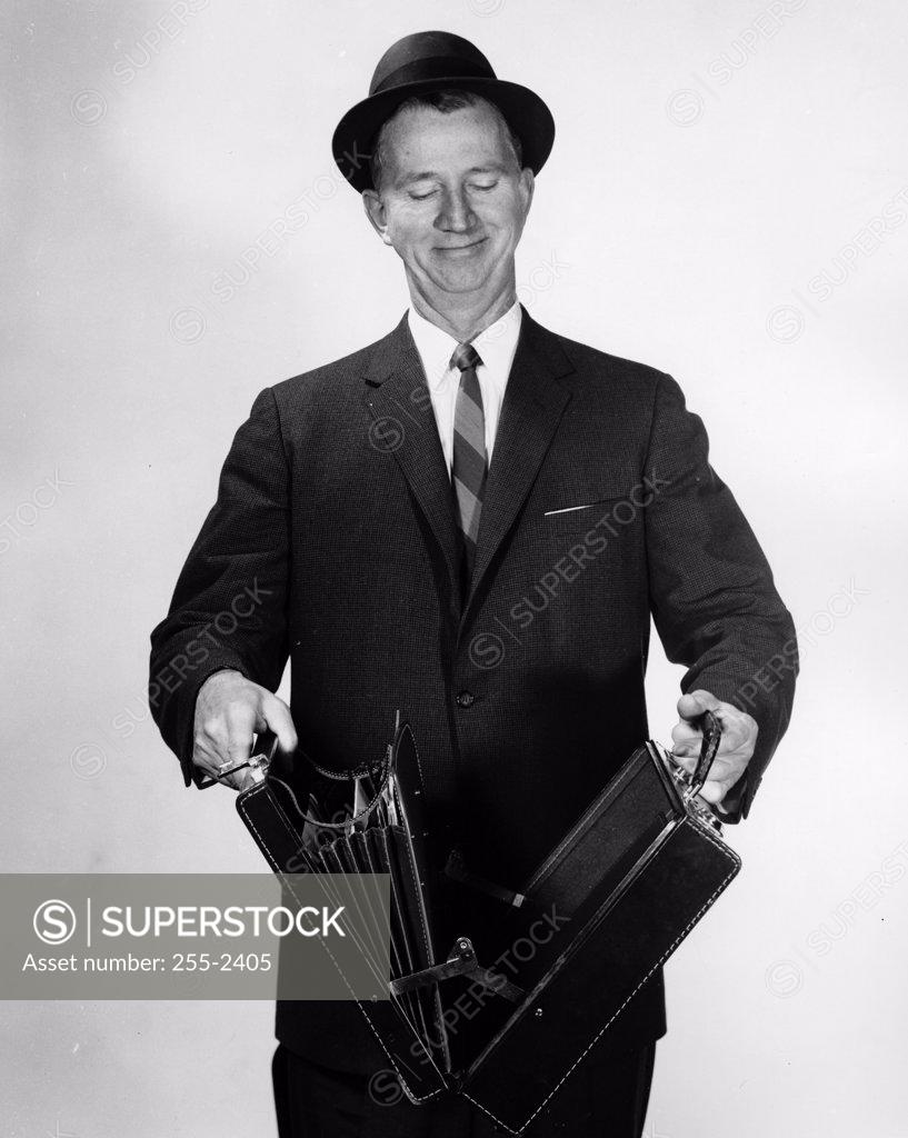 Stock Photo: 255-2405 Close-up of a businessman opening a briefcase