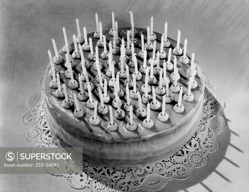 Stock Photo: 255-24091 High angle view of a birthday cake decorated with candles