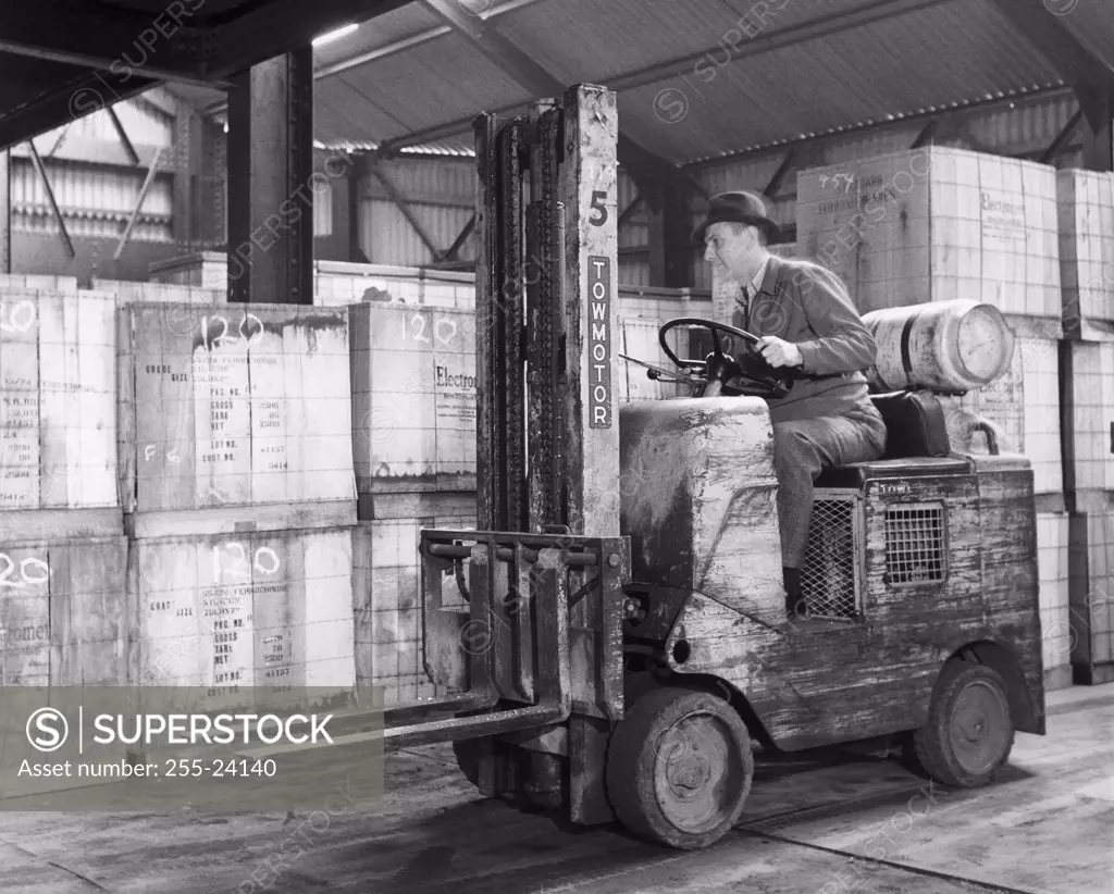 Man driving a forklift in a warehouse