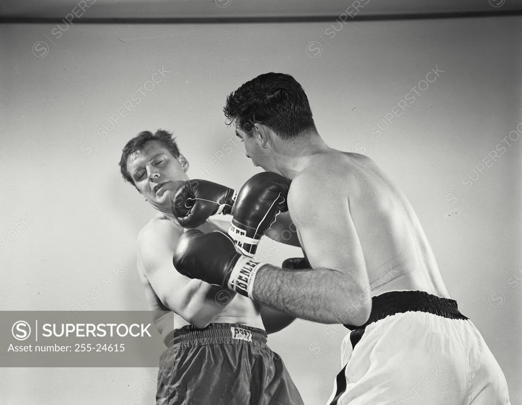 Stock Photo: 255-24615 Two mid adult men boxing