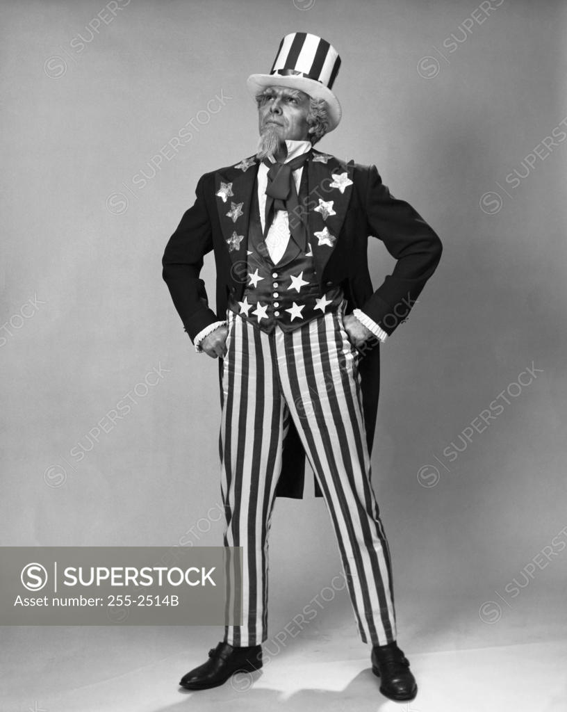 Stock Photo: 255-2514B Senior man in Uncle Sam costume standing with arms akimbo