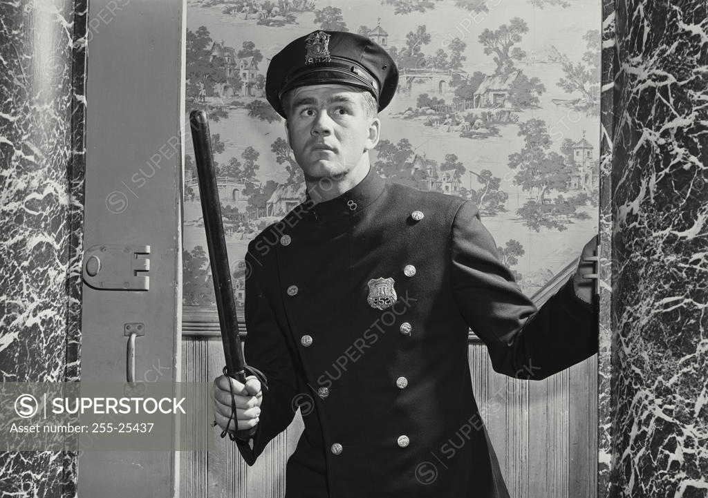 Stock Photo: 255-25437 Close-up of a policeman holding a stick