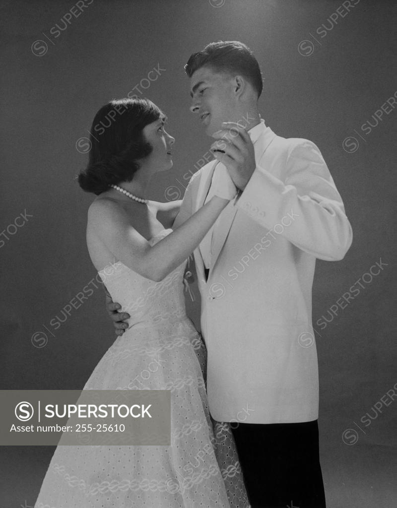 Stock Photo: 255-25610 Side profile of a young couple dancing