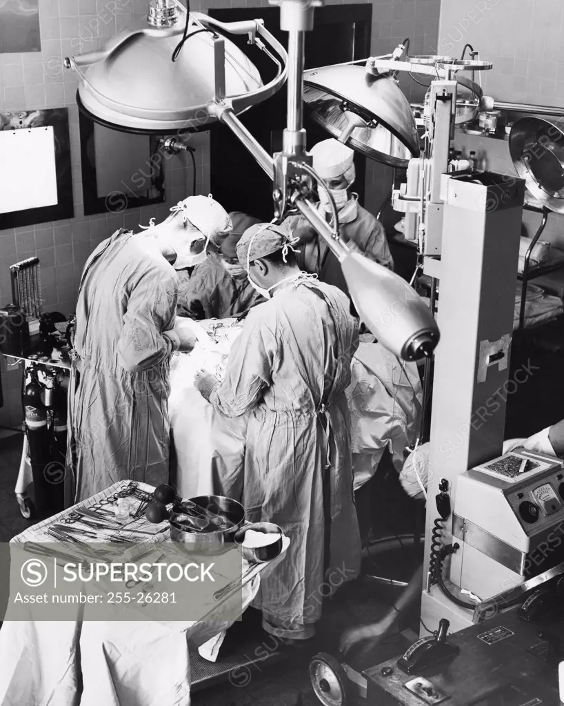 Surgeons performing surgery in an operating room