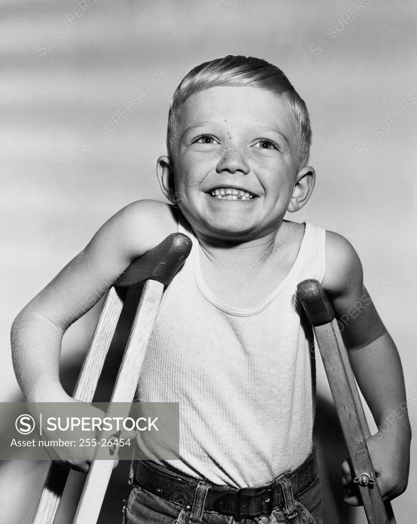Stock Photo: 255-26454 Close-up of a boy standing on crutches