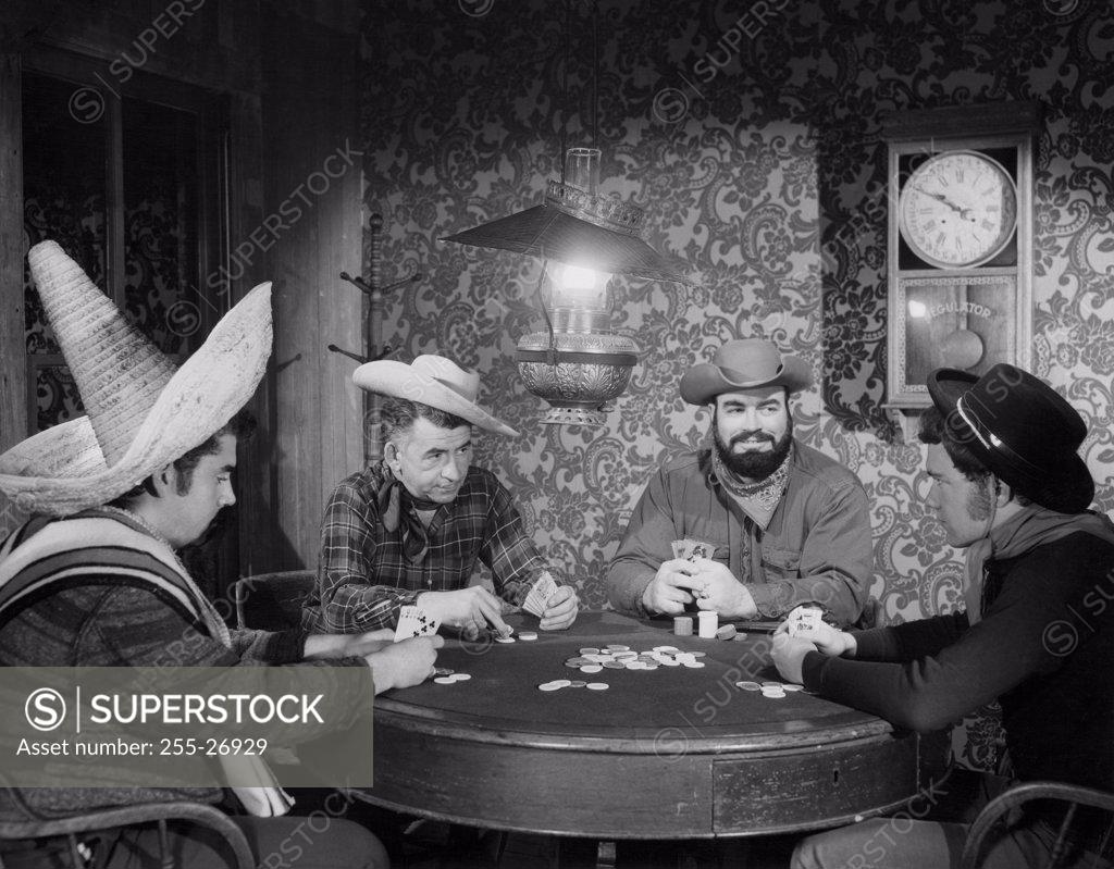 Stock Photo: 255-26929 Cowboys playing poker in a casino