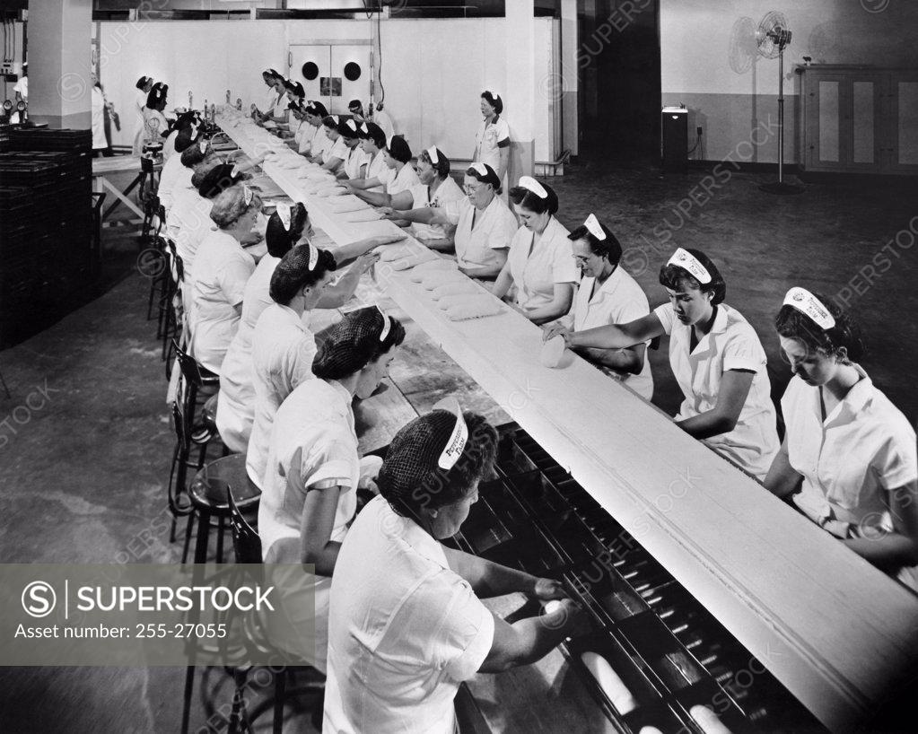 Stock Photo: 255-27055 High angle view of a group of female workers working in a bread factory