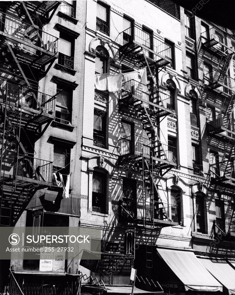 Stock Photo: 255-27932 USA, New York City, low angle view of fire escapes of residential buildings