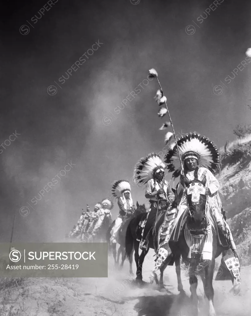 Group of Yakama people riding horses