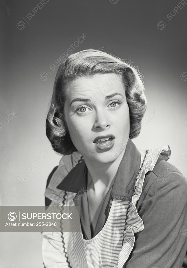 Stock Photo: 255-2848 Portrait of a young woman looking surprised