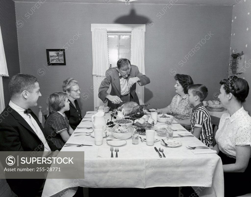 Stock Photo: 255-28771 Family at a dining table on Thanksgiving Day