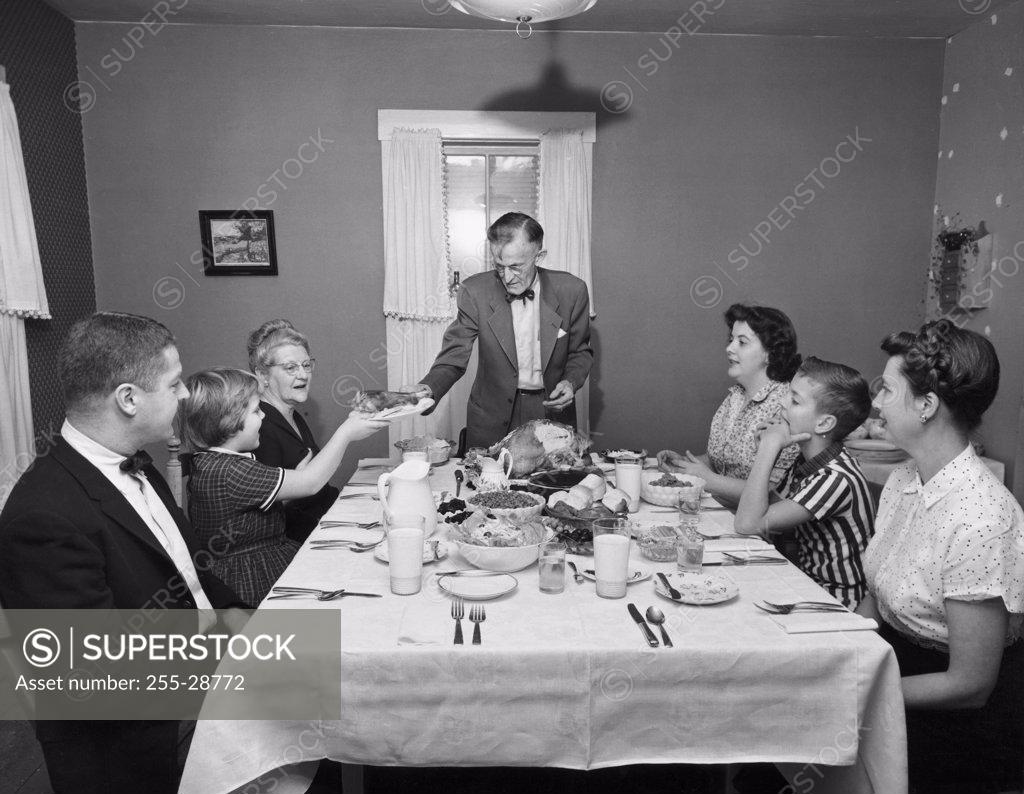 Stock Photo: 255-28772 Family at a dining table on Thanksgiving Day