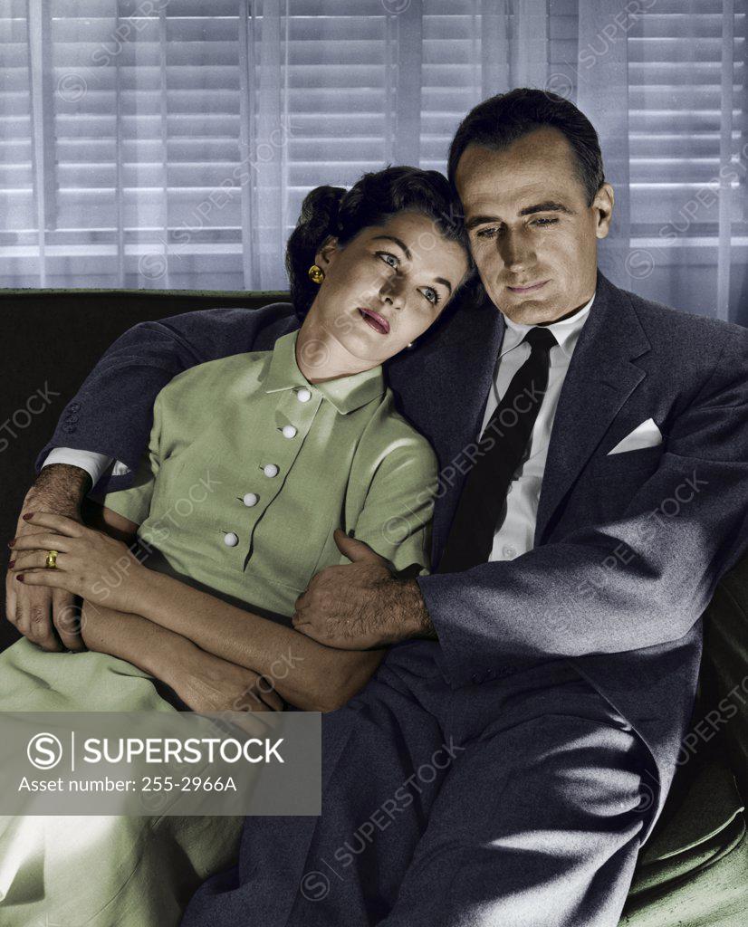 Stock Photo: 255-2966A Close-up of mid adult couple sitting on couch