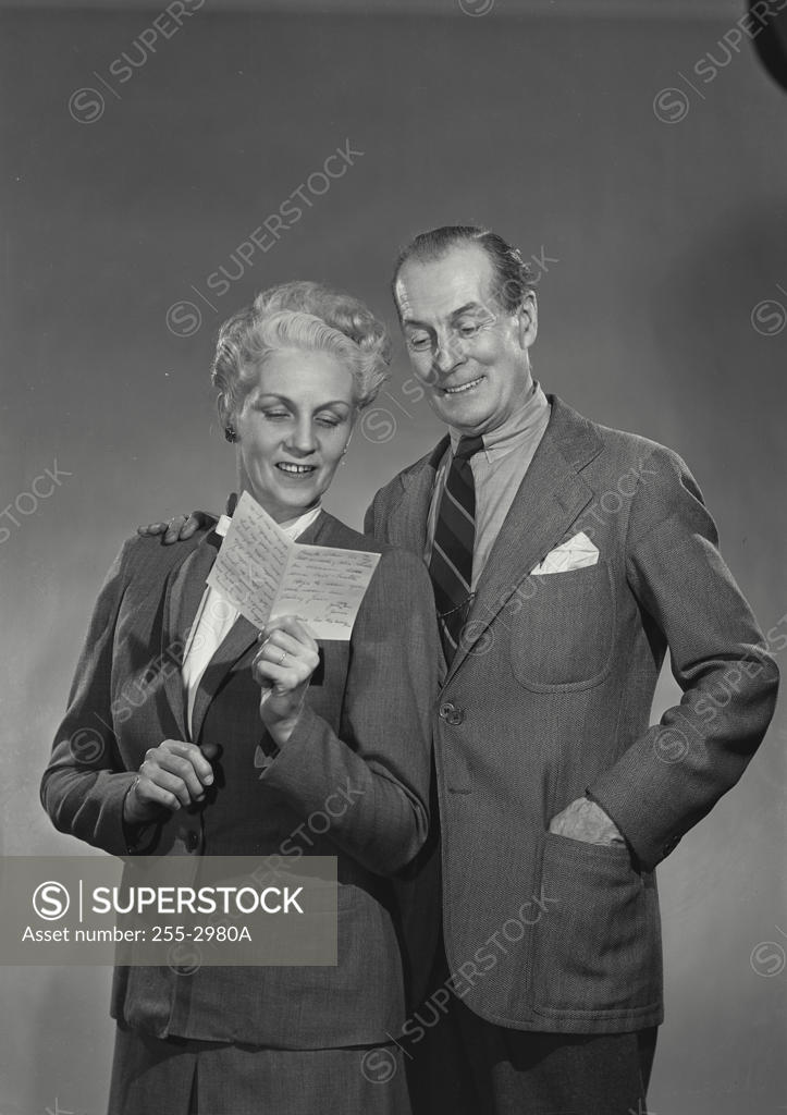 Stock Photo: 255-2980A Close-up of a senior couple reading a letter