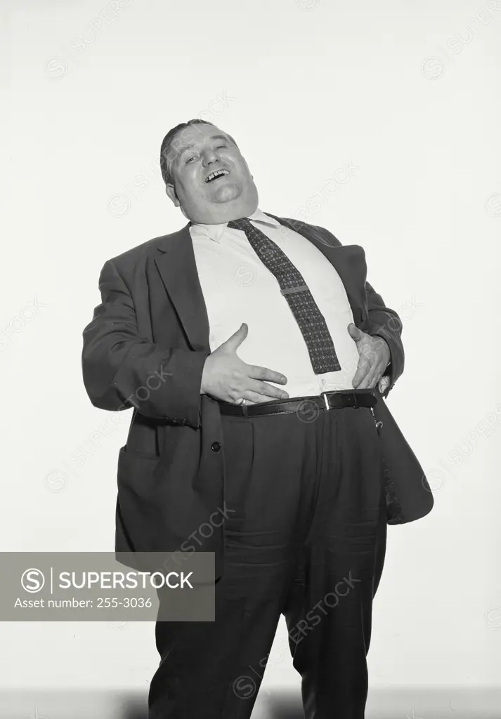 Portrait of an obese man laughing
