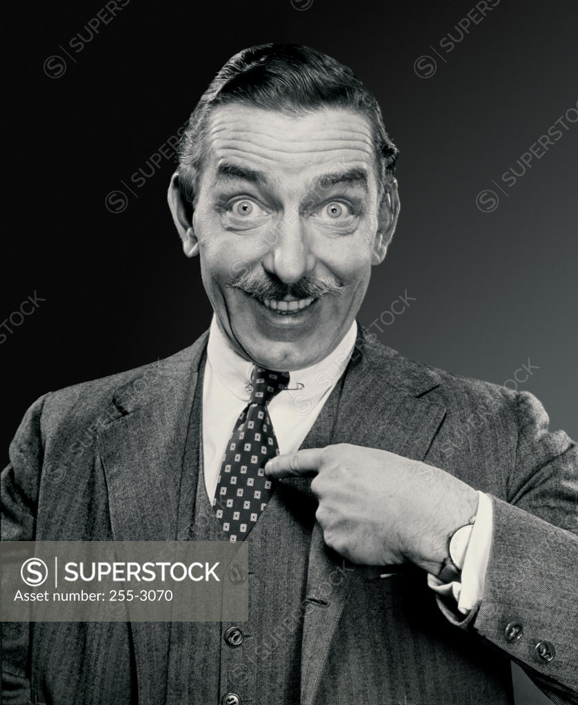 Stock Photo: 255-3070 Portrait of a businessman pointing at himself