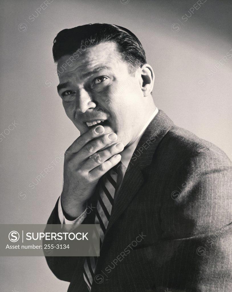 Stock Photo: 255-3134 Side profile of a businessman thinking with his hand on his chin