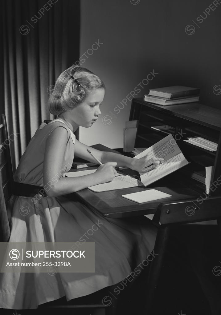 Stock Photo: 255-3298A Side profile of a girl studying