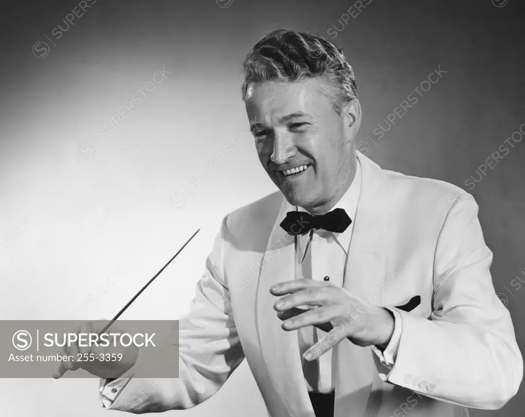 Close-up of a music conductor holding a conductor's baton