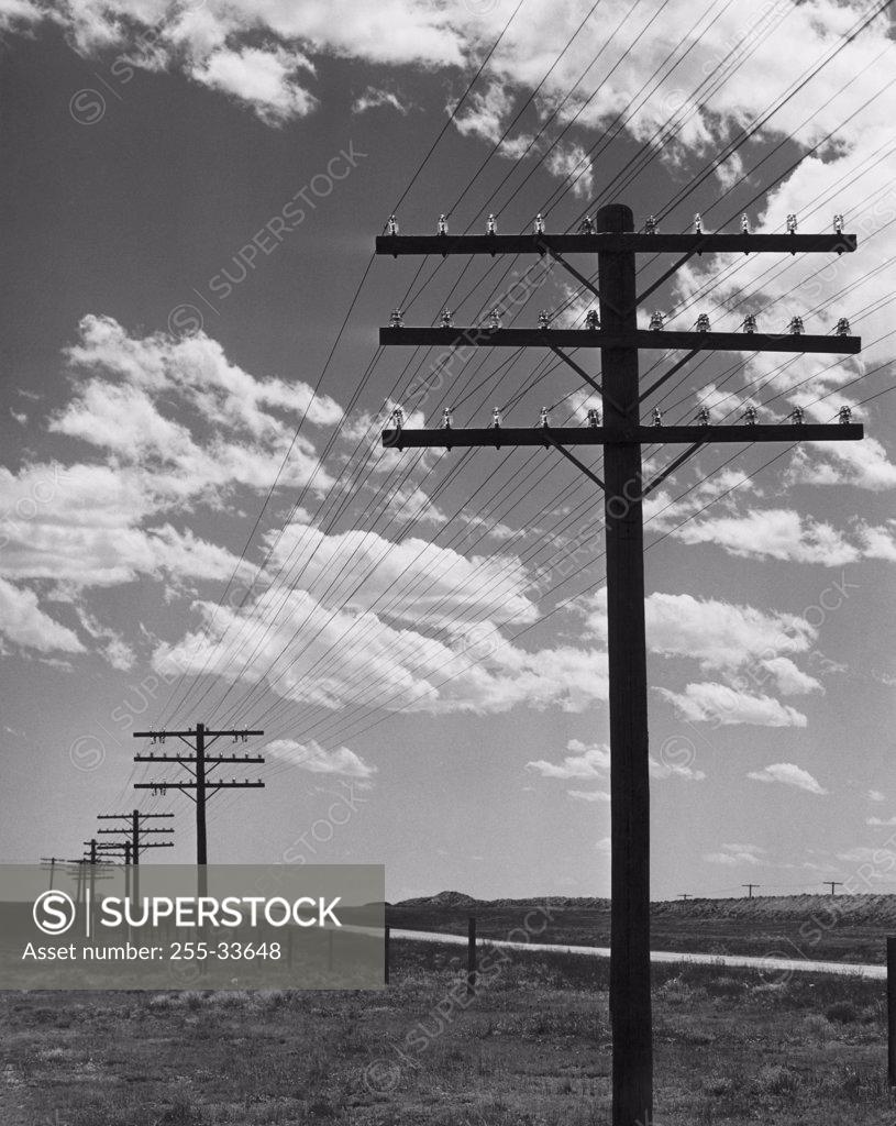 Stock Photo: 255-33648 Telephone lines along a road, Wyoming, USA