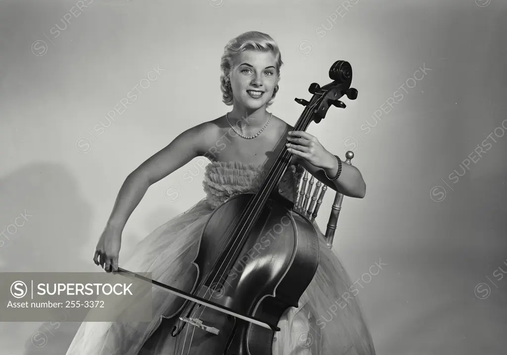 Portrait of a young woman playing the cello