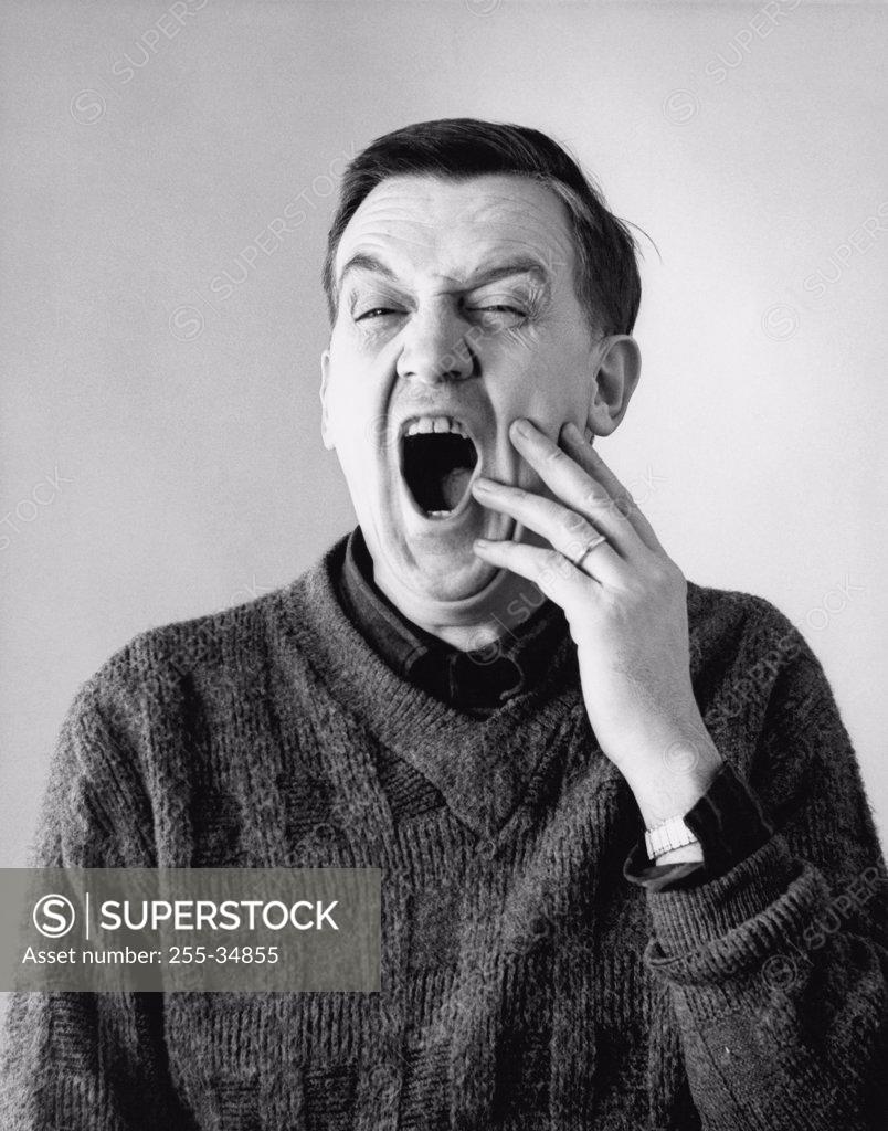 Stock Photo: 255-34855 Close-up of a senior man with a toothache