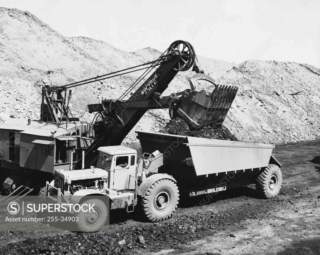 Stock Photo: 255-34903 Loading coal in a dump truck in a mining operation