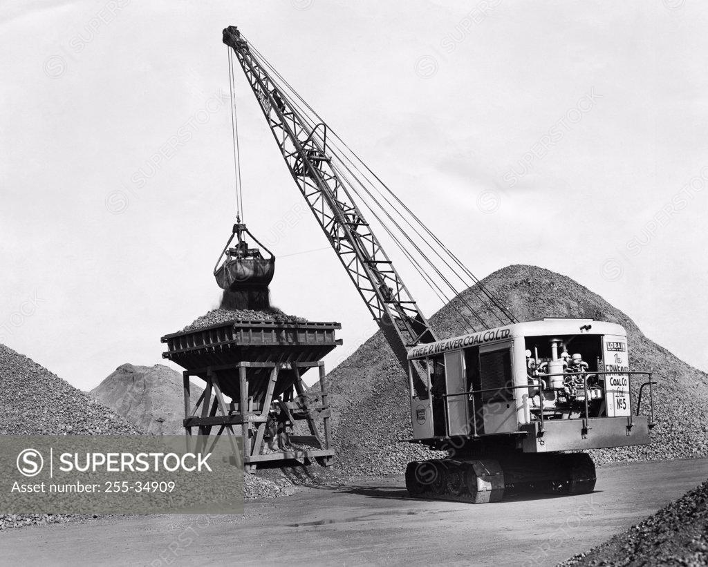 Stock Photo: 255-34909 Crane loading coal
