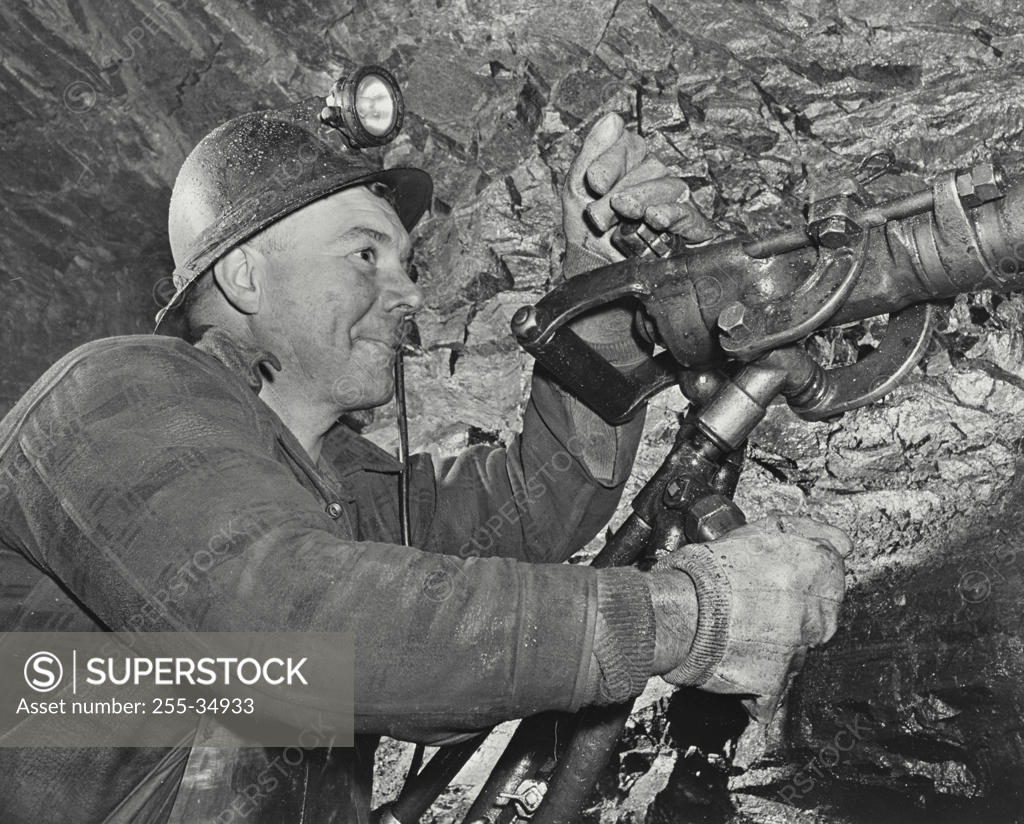 Stock Photo: 255-34933 Miner using a jackhammer
