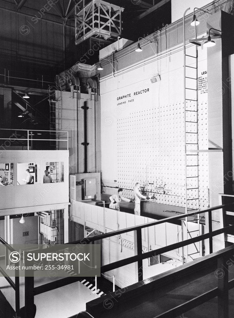 Stock Photo: 255-34981 High angle view of scientists working in a nuclear laboratory, Graphite Reactor, Oak Ridge National Laboratory, Oak Ridge, Tennessee, USA